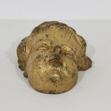 Carved giltwood baroque angel head, France circa 1650-1750