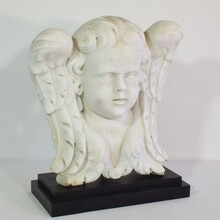 Carved white marble winged angel head, Italy circa 1650-1750