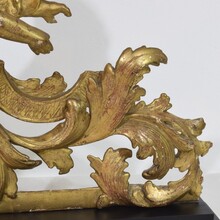 Carved giltwood baroque angel on curl ornament, Italy circa 1750