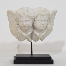 Carved white marble winged double angle head ornament, Italy circa 1750