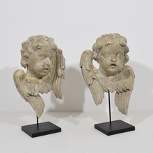 Pair carved wooden winged angel head ornaments, Italy circa 1650-1750