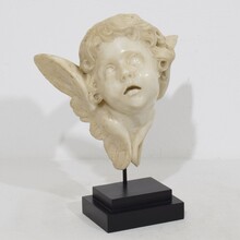 Carved white marble winged angel head ornament, Spain circa 1750
