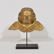 Baroque carved giltwood angel head on wings, Italy circa 1750