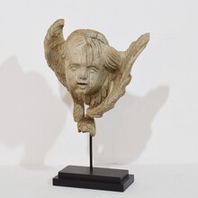 Baroque carved oak angel head on wing, France circa 1750