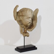 Baroque carved oak angel head on wing, France circa 1750