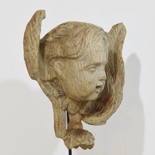 Baroque carved oak angel head on wing, France circa 1750