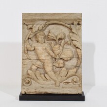 Carved oak panel depicting an angel on an acanthus curl, France circa 1750