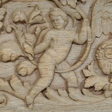 Carved oak panel depicting two angels and an eagle, France circa 1750