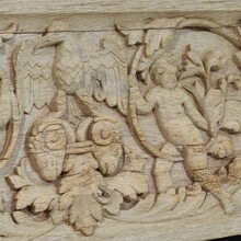 Carved oak panel depicting two angels and an eagle, France circa 1750