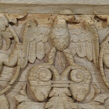 Carved oak panel depicting two angels and an eagle, France circa 1750