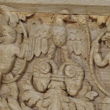 Carved oak panel depicting two angels and an eagle, France circa 1750