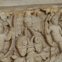 Carved oak panel depicting two angels and an eagle, France circa 1750