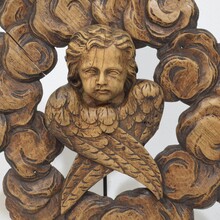 Carved oak winged angel head in clouds ornament, France circa 1800-1850