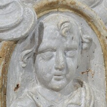 Carved wooden baroque panel depicting a Saint with angels, France circa 1650-1750