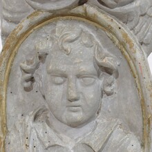 Carved wooden baroque panel depicting a Saint and angels, France circa 1650-1750