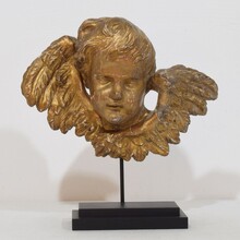 Baroque carved giltwood winged angel head, France circa 1700-1750