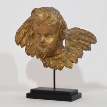 Baroque carved giltwood winged angel head, France circa 1700-1750