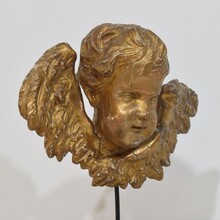 Baroque carved giltwood winged angel head, France circa 1700-1750