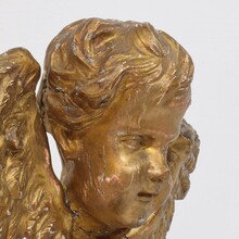 Baroque carved giltwood winged angel head, France circa 1700-1750