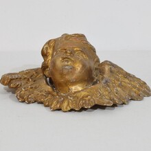 Baroque carved giltwood winged angel head, France circa 1700-1750