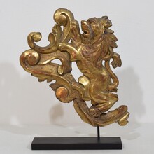 Hand carved giltwood standing lion on curl, France circa 1750