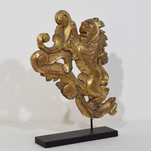 Hand carved giltwood standing lion on curl, France circa 1750