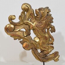 Hand carved giltwood standing lion on curl, France circa 1750