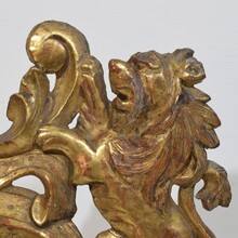 Hand carved giltwood standing lion on curl, France circa 1750