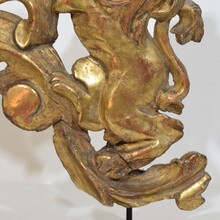 Hand carved giltwood standing lion on curl, France circa 1750