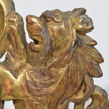 Hand carved giltwood standing lion on curl, France circa 1750