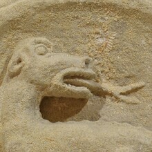 Medieval carved stone fragment depicting a dragon/mythical figure, France circa 1250-1450