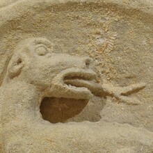 Medieval carved stone fragment depicting a dragon/mythical figure, France circa 1250-1450