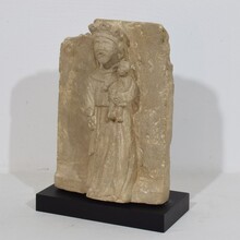 Medieval carved stone panel depicting a Madonna with child, France before 1600