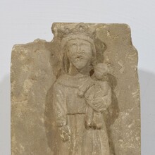 Medieval carved stone panel depicting a Madonna with child, France before 1600