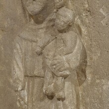 Medieval carved stone panel depicting a Madonna with child, France before 1600