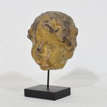 Carved giltwood baroque angel head, Italy circa 1650-1750