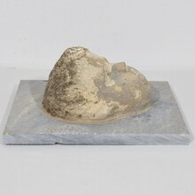 Carved stone cherub fountain head on marble panel, Italy circa 1650-1750