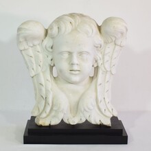 Carved white marble winged angel head, Italy circa 1650-1750