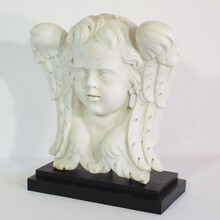 Carved white marble winged angel head, Italy circa 1650-1750