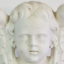 Carved white marble winged angel head, Italy circa 1650-1750