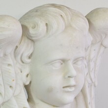 Carved white marble winged angel head, Italy circa 1650-1750