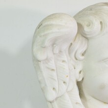 Carved white marble winged angel head, Italy circa 1650-1750