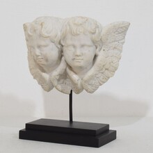 Carved white marble winged double angle head ornament, Italy circa 1750