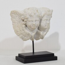 Carved white marble winged double angle head ornament, Italy circa 1750