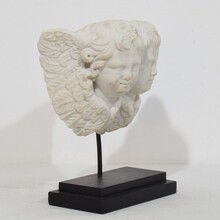 Carved white marble winged double angle head ornament, Italy circa 1750