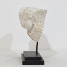 Carved white marble winged double angle head ornament, Italy circa 1750