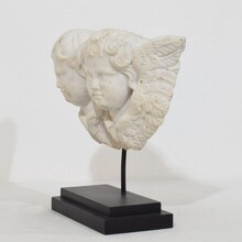 Carved white marble winged double angle head ornament, Italy circa 1750