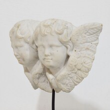 Carved white marble winged double angle head ornament, Italy circa 1750