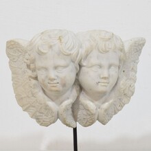 Carved white marble winged double angle head ornament, Italy circa 1750