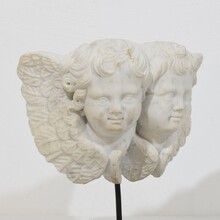 Carved white marble winged double angle head ornament, Italy circa 1750